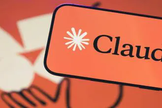 Close-up of the Claude logo on a vibrant orange background