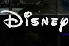 Close-up of the Disney logo sign displayed on a storefront.