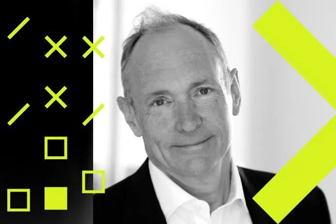 A smiling man in a suit against a creative background featuring geometric shapes.