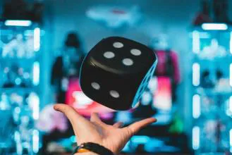throwing-dice-in-blue-lit-room
